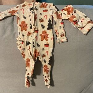 Waffle ruffle onesie in cute Christmas print with matching headband.